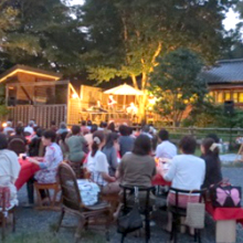 Evening in summer, enjoying music on an outdoor stage 